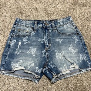 Justice stretch denim shorts with butterflies